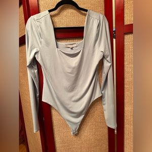 Crave Fame light blue long sleeve bodysuit size L